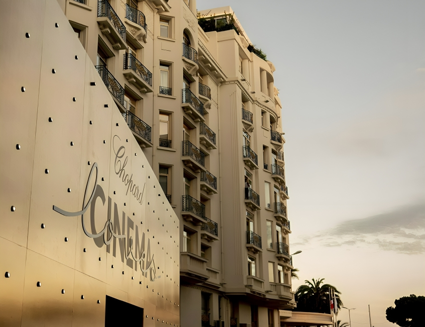Building facade with 'Chopard Loves Cinema' displayed on the surface.