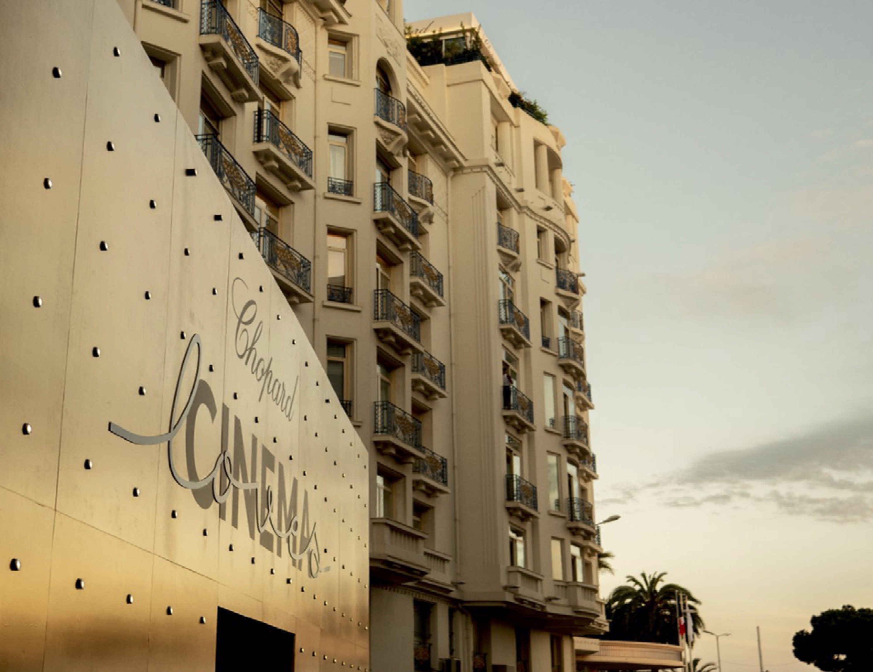 Building facade with 'Chopard Loves Cinema' displayed on the surface.