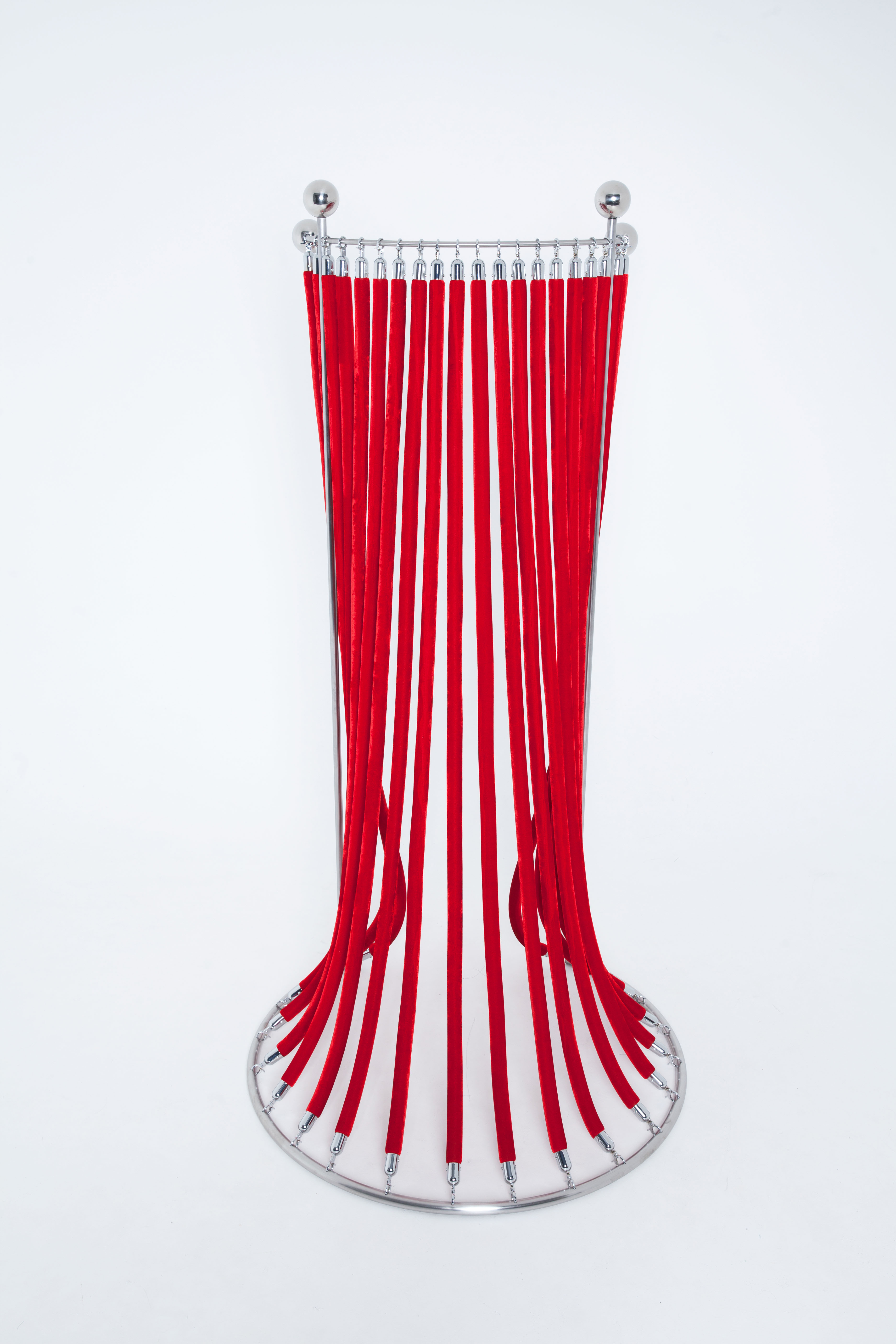 Art sculpture featuring velvet ropes symbolizing fluid identity and belonging.